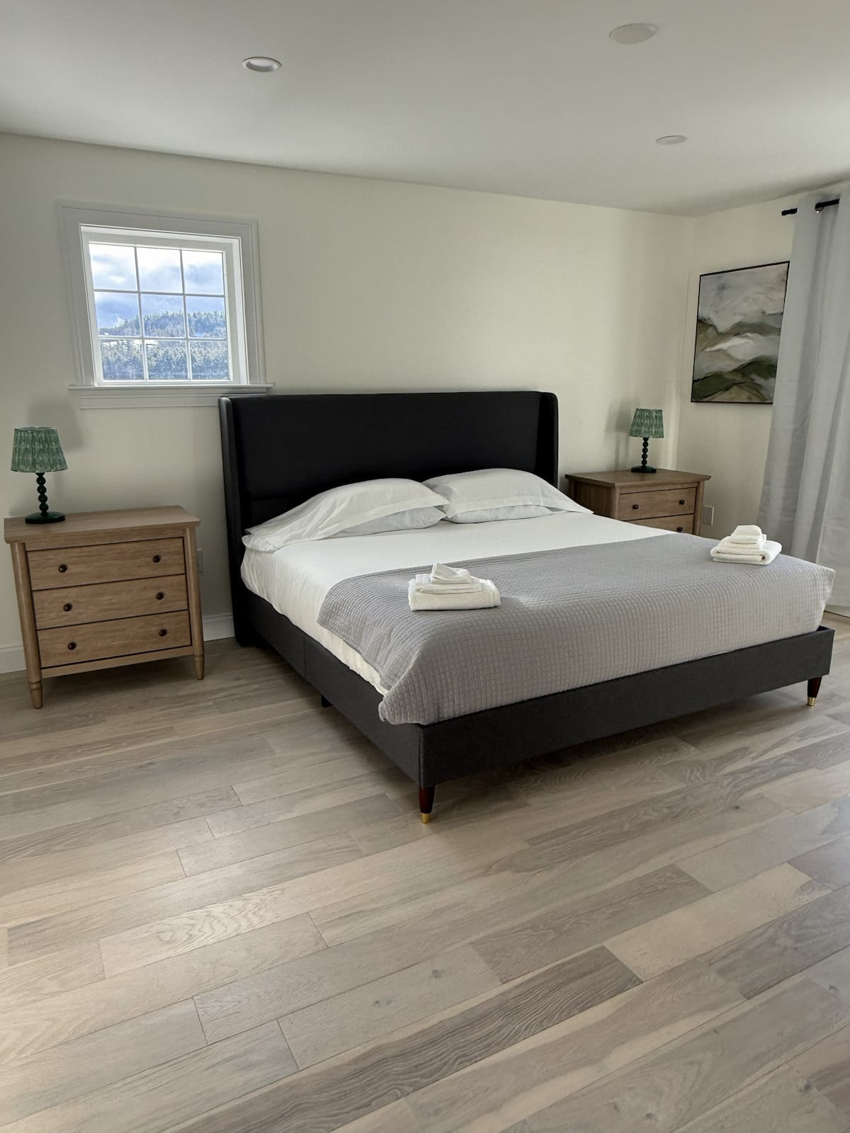 King bedroom with mountain art